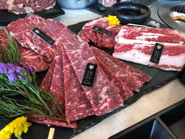 Photograph of raw wagyu meat waiting to be cooked.