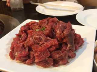Photograph of a raw salted bavette steak.