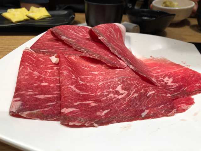 Photograph of a raw meat for shabu-shabu.